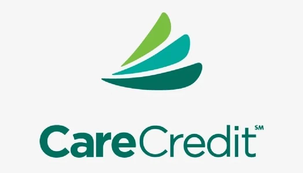 Logo of CareCredit with green and teal swooshes.