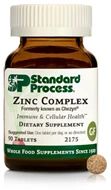 A brown bottle labeled 'Zinc Complex' dietary supplement from Standard Process.