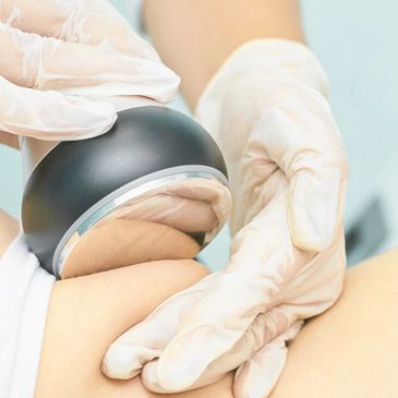 A close-up of a medical professional performing an ultrasound.