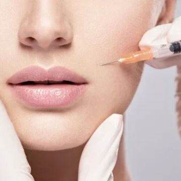 Close-up of cosmetic injection on a woman's face.