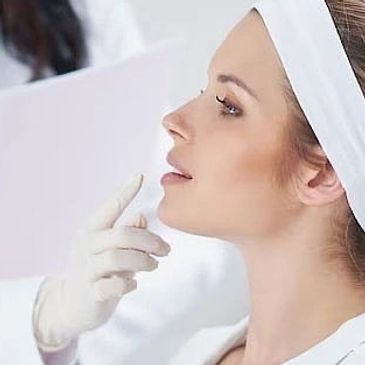A woman receiving a cosmetic facial injection.