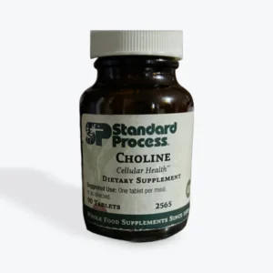 A bottle of Standard Process Choline dietary supplement.
