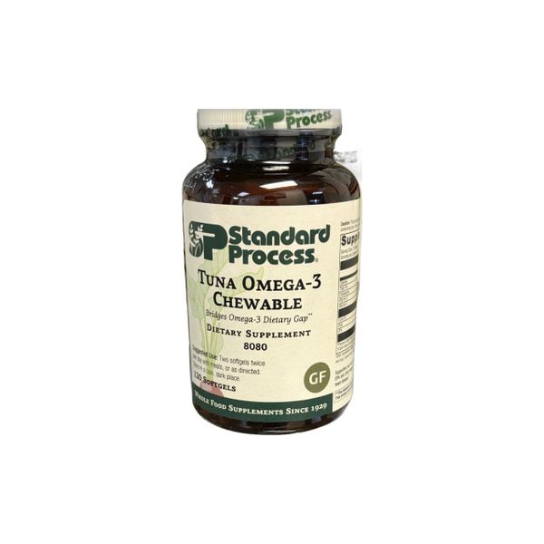 A bottle of Standard Process Turmeric-3 Curcumin supplement.